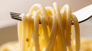 Perfectly cooked, non-sticky spaghetti twirled on a fork.